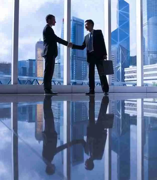 Business partnership handshake
